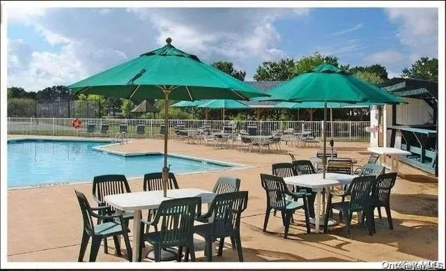 a patio with a table and chairs