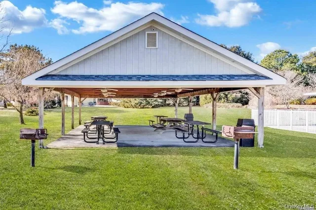 a patio with a table and chairs