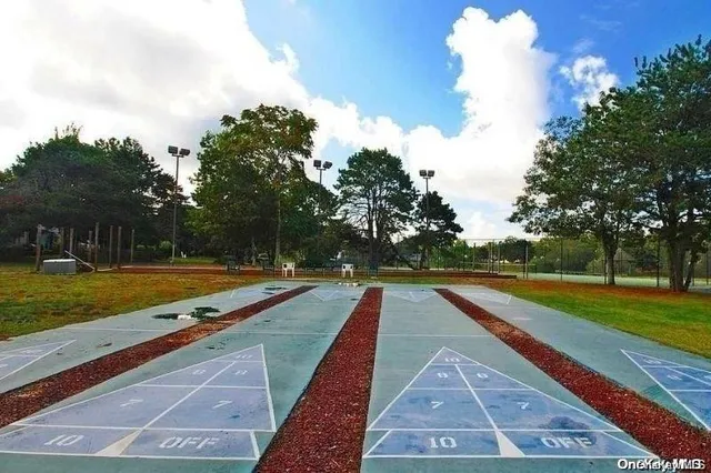 a view of swimming pool with a yard