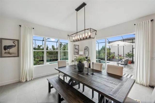 a view of a patio with a table and chairs