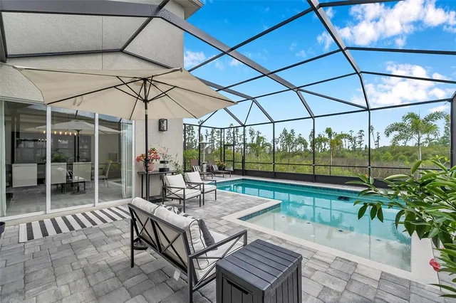 a bathroom with a sink a mirror a vanity and a shower