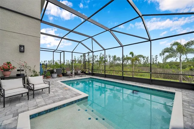 a bedroom with a bed and a potted plant