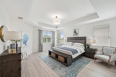 a view of a kitchen and a refrigerator