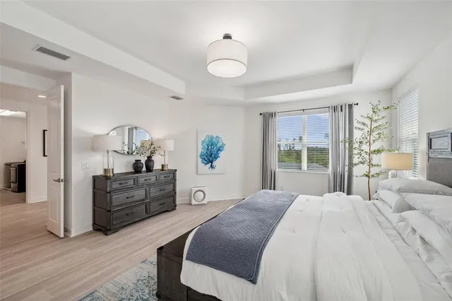 a bedroom with a bed and a desk