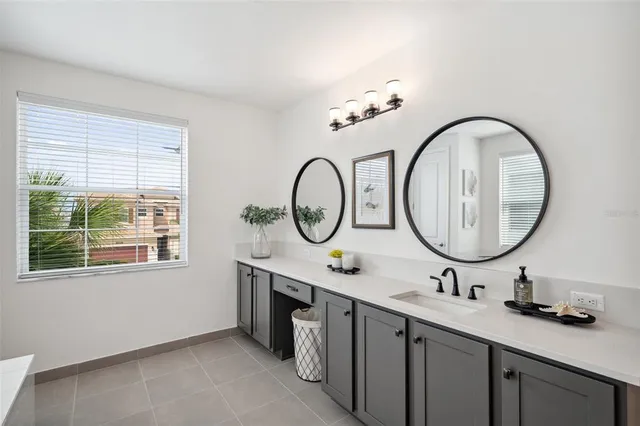 a bedroom with a bed a desk and chair