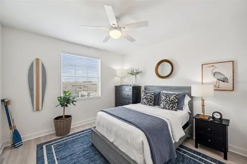 a view of a workspace with furniture and wooden floor