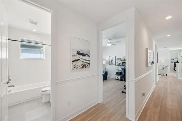 a bedroom with furniture and a wooden floor