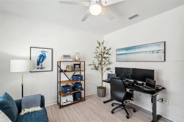 an aerial view of a house with a swimming pool and outdoor space