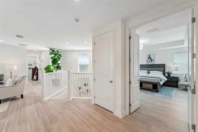 a view of a swimming pool with a patio and a yard