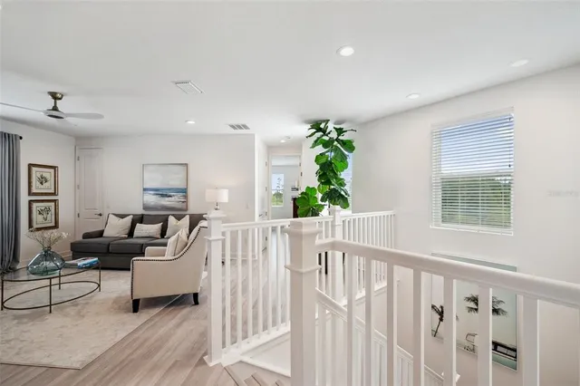 a view of a city with an outdoor space and seating