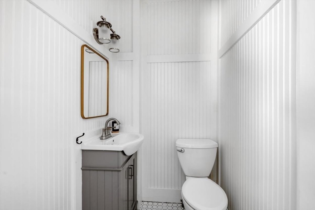 55 Whiton Avenue Hingham, MA 02043 - Photo 20 of 30 a bathroom with a toilet sink and mirror