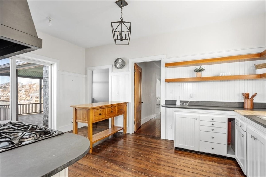 55 Whiton Avenue Hingham, MA 02043 - Photo 9 of 30 a open kitchen with granite countertop a stove and a refrigerator