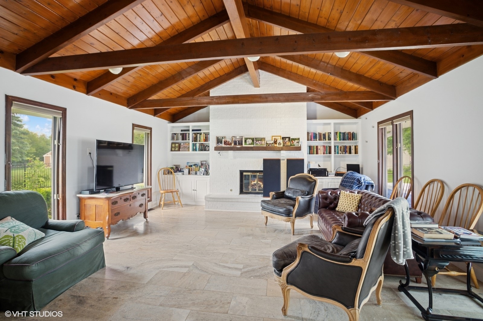 2050 Beechnut Road Northbrook, IL 60062 - Photo 8 of 18 a living room with furniture a fireplace and a flat screen tv