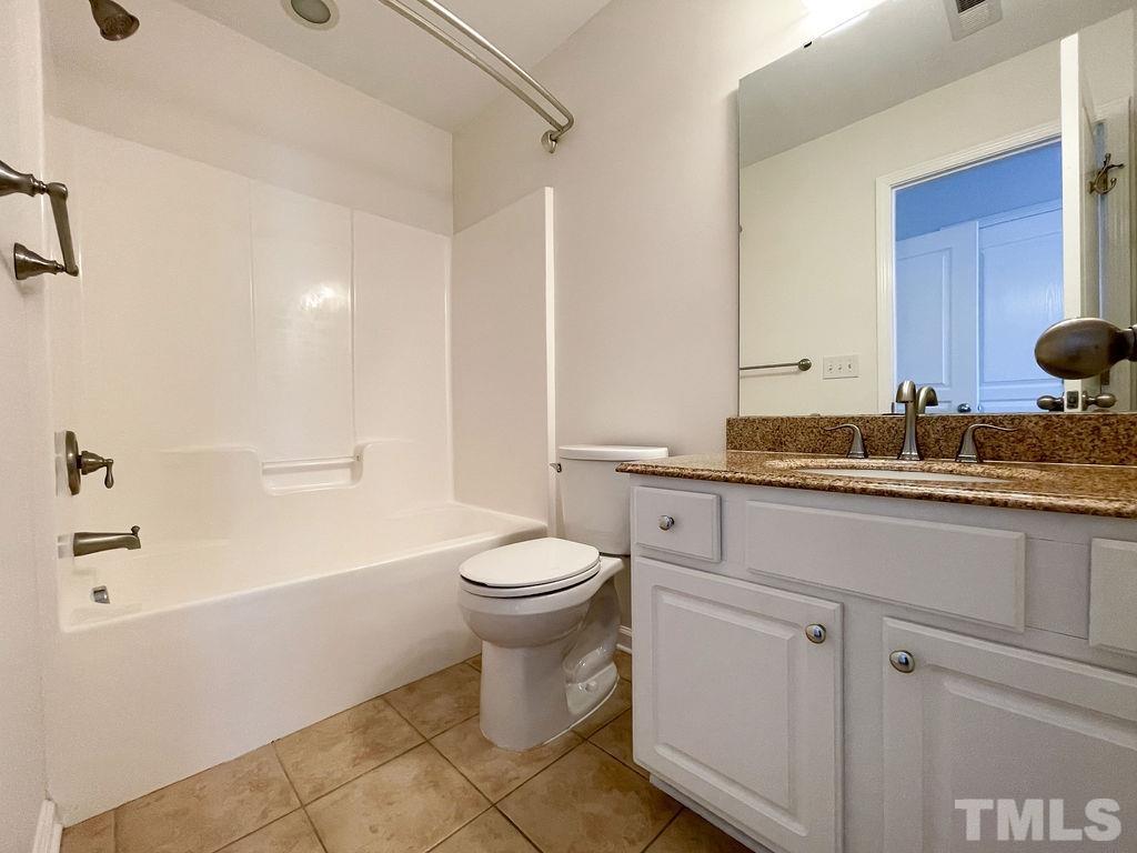 7841 Silverthread Lane Raleigh, NC 27617 - Photo 11 of 15 a bathroom with a sink a toilet and shower