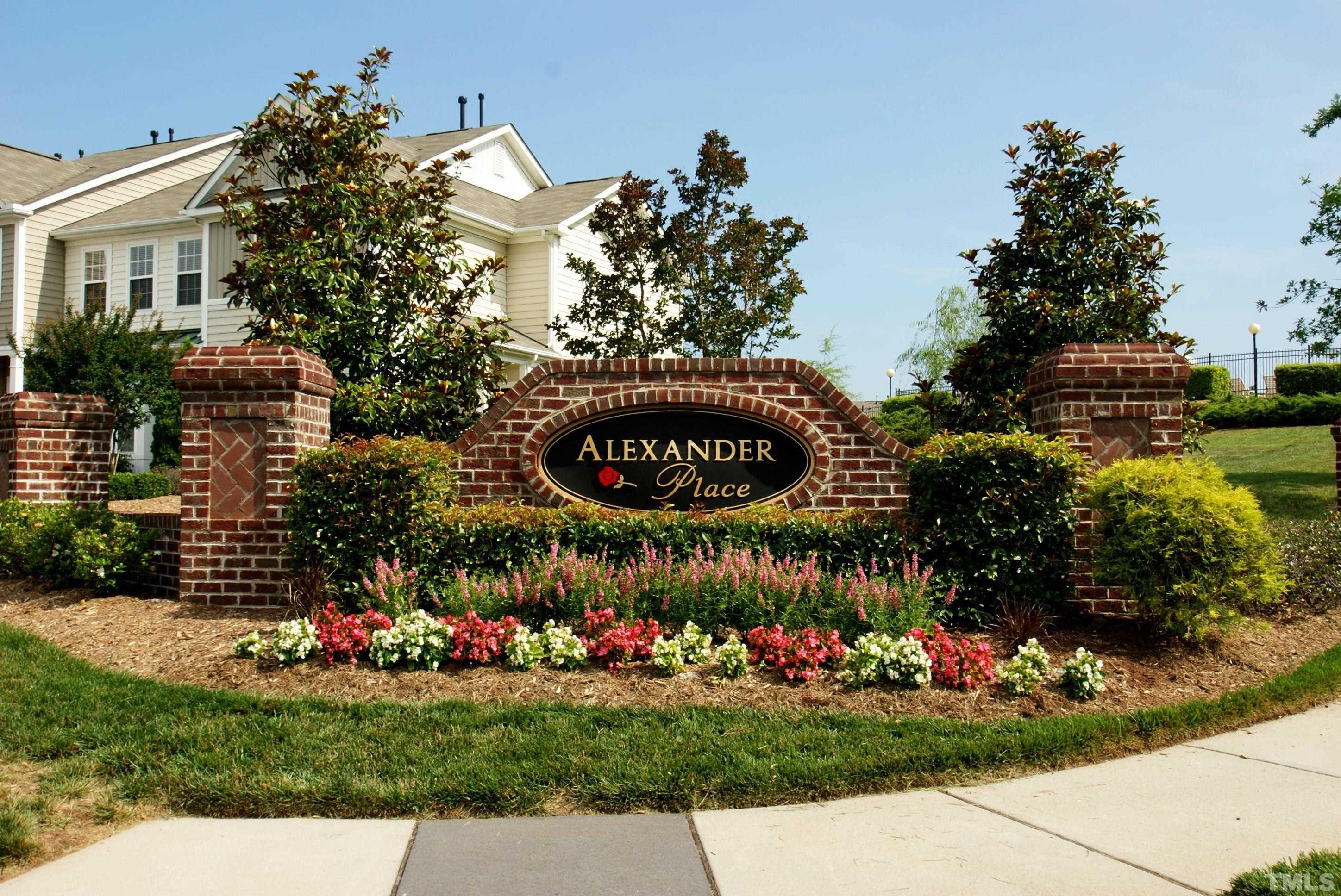 7841 Silverthread Lane Raleigh, NC 27617 - Photo 13 of 15 a sign that is sitting in front of flowers