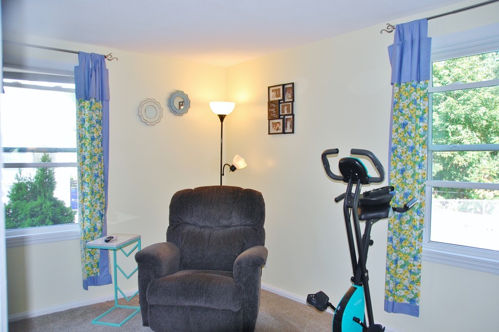 39 Lumae Street Springfield, MA 01119 - Photo 13 of 26 a living room with furniture and a window