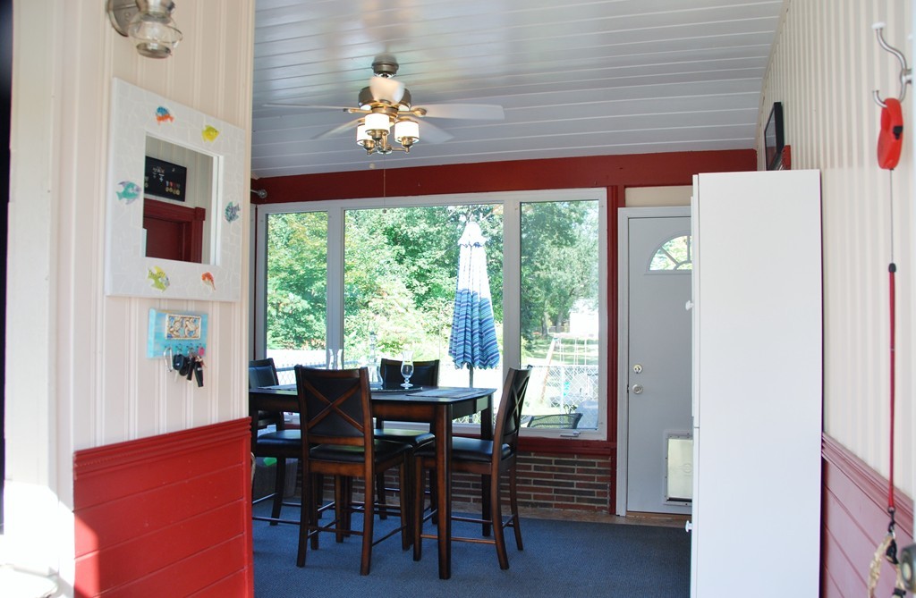 39 Lumae Street Springfield, MA 01119 - Photo 15 of 26 a view of a dining room with furniture a chandelier and wooden floor