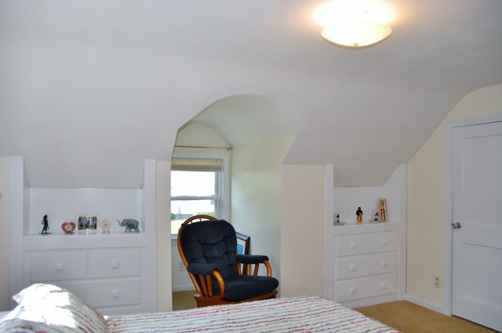 39 Lumae Street Springfield, MA 01119 - Photo 19 of 26 a bedroom with a bed and window