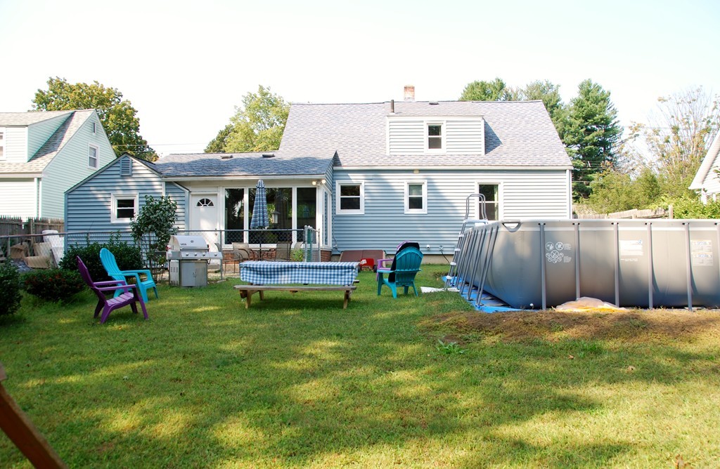 39 Lumae Street Springfield, MA 01119 - Photo 25 of 26 a front view of a house with garden and sitting area