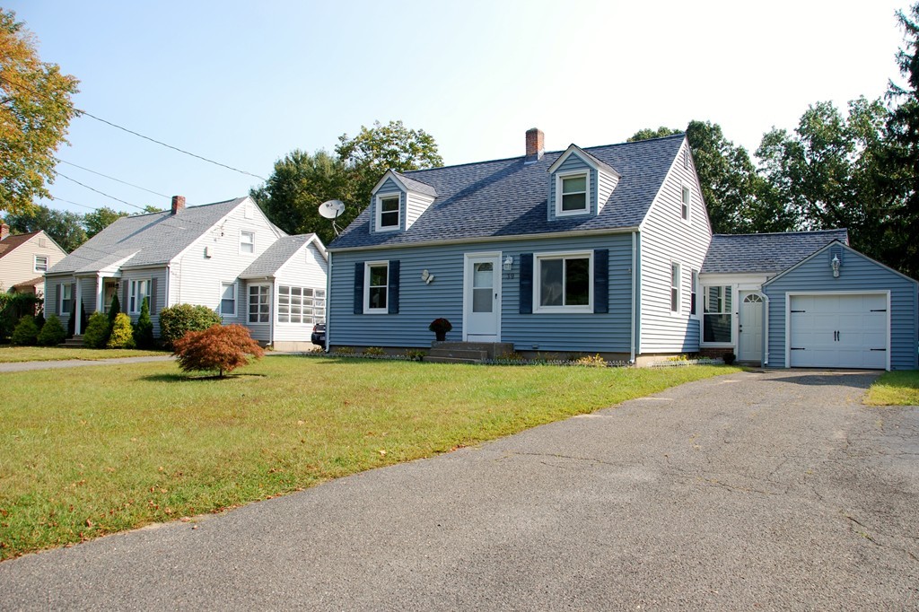 39 Lumae Street Springfield, MA 01119 - Photo 26 of 26 a front view of a house with a garden and porch