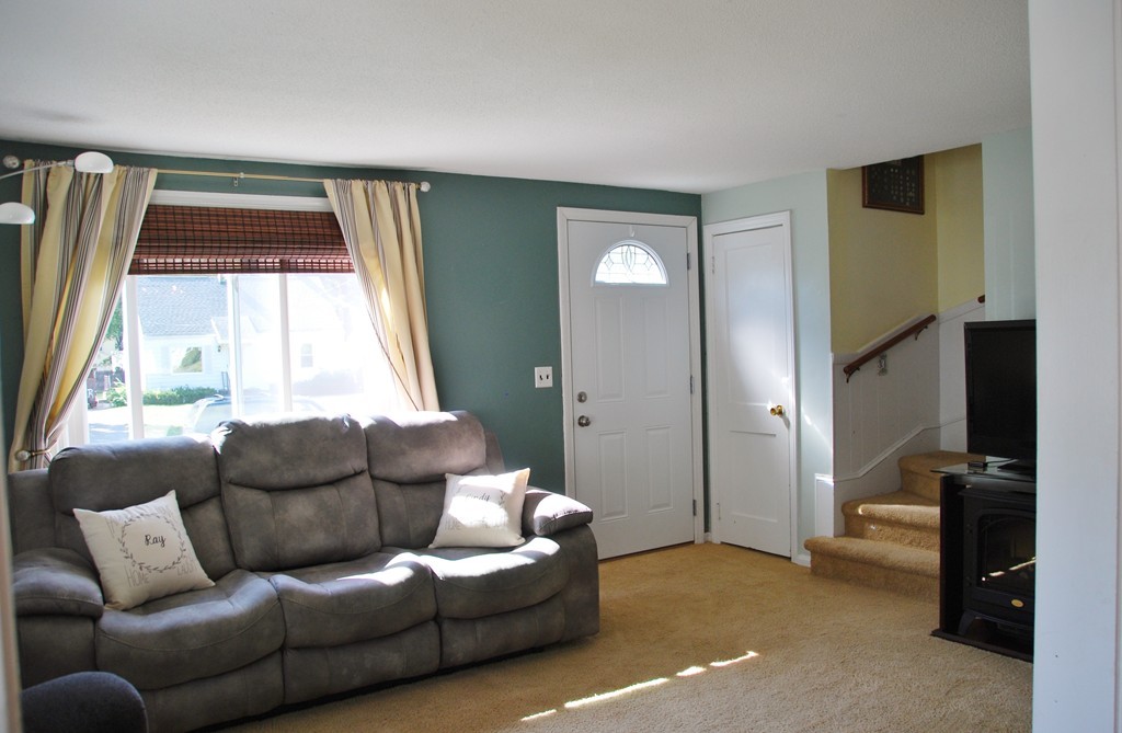 39 Lumae Street Springfield, MA 01119 - Photo 5 of 26 a living room with furniture and a window