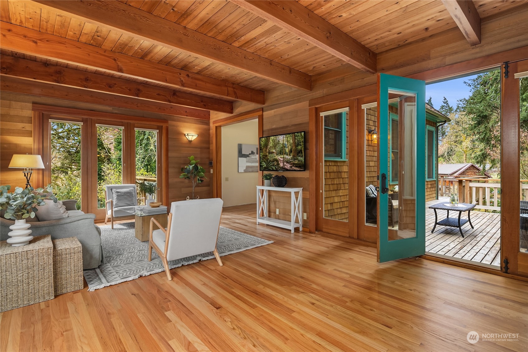 8251 Northeast Beck Road Bainbridge Island, WA 98110 - Photo 14 of 40 a living room filled with furniture and wooden floor
