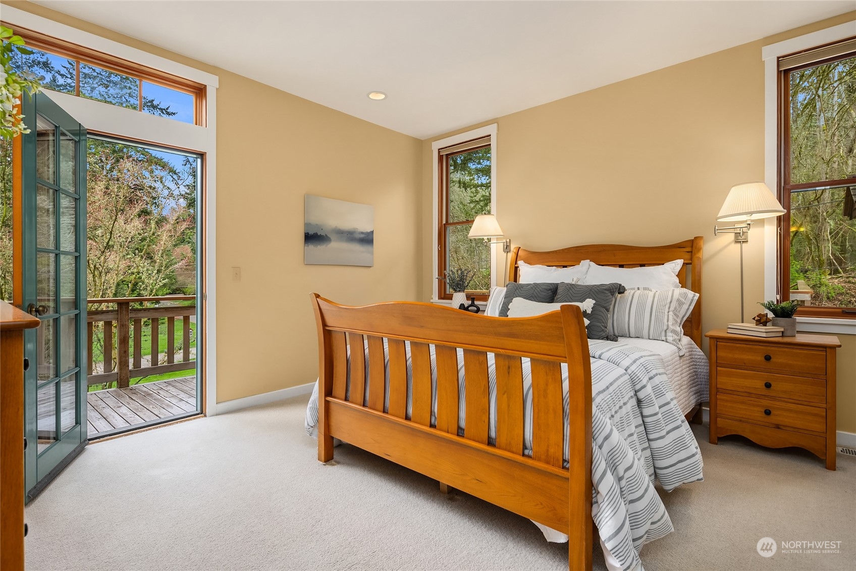 8251 Northeast Beck Road Bainbridge Island, WA 98110 - Photo 20 of 40 a spacious bedroom with a bed and a window