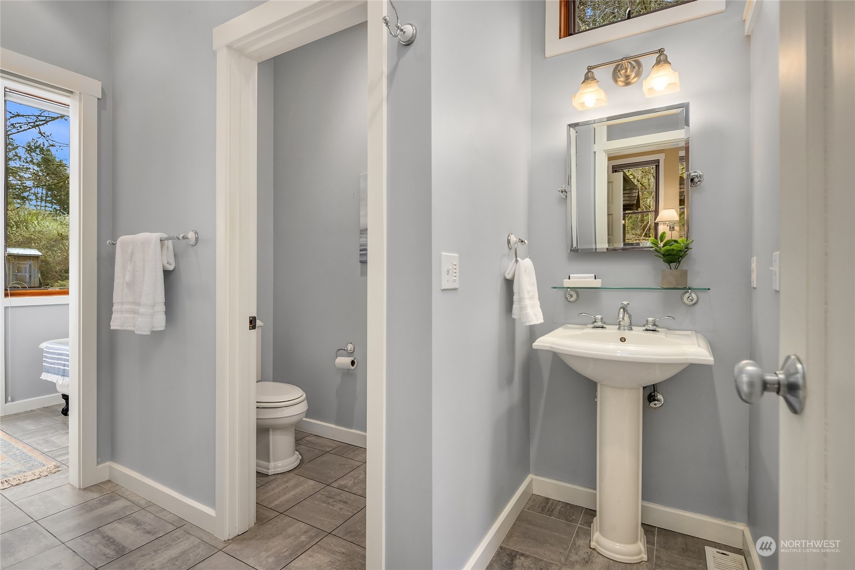 8251 Northeast Beck Road Bainbridge Island, WA 98110 - Photo 22 of 40 a bathroom with a sink toilet and shower