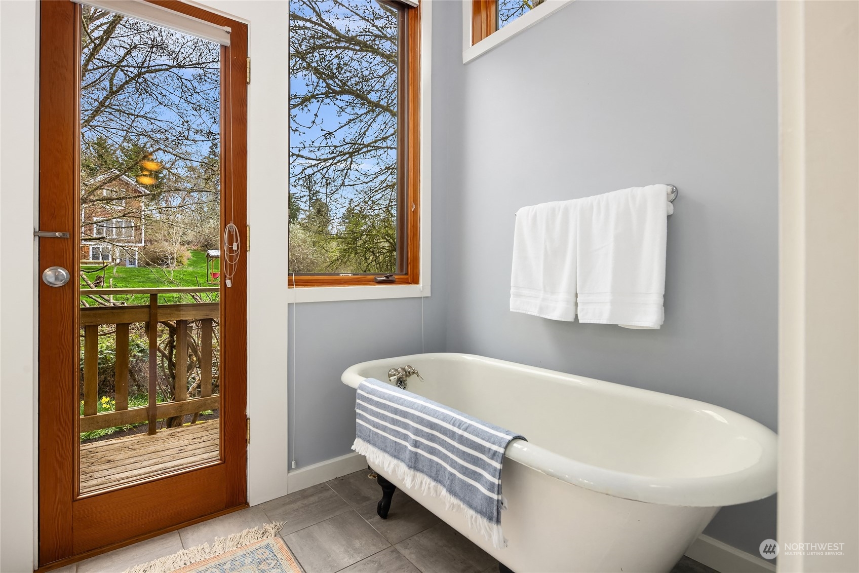 8251 Northeast Beck Road Bainbridge Island, WA 98110 - Photo 24 of 40 a bathroom with bathtub and shower