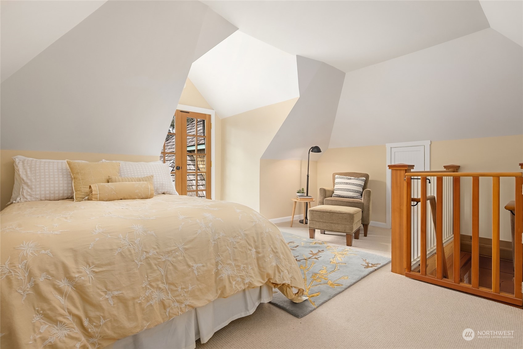 8251 Northeast Beck Road Bainbridge Island, WA 98110 - Photo 27 of 40 a bedroom with a bed and dresser