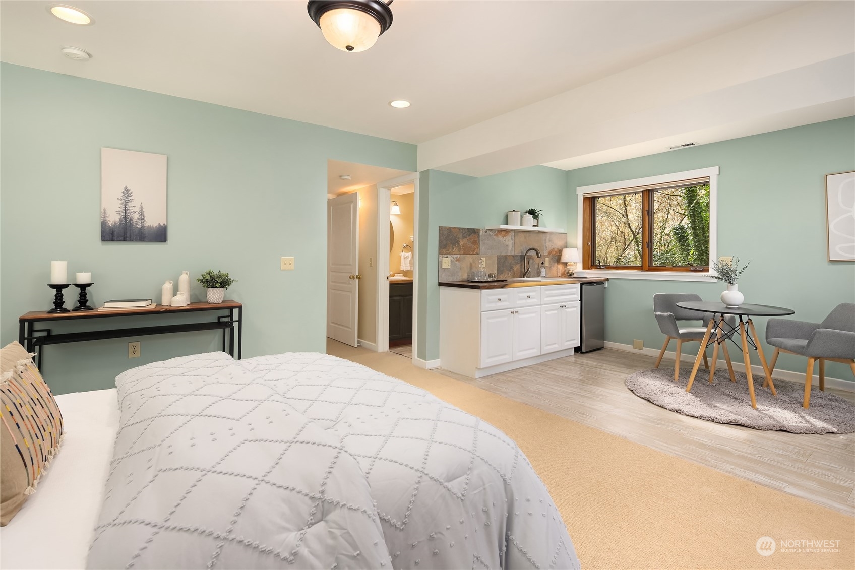 8251 Northeast Beck Road Bainbridge Island, WA 98110 - Photo 32 of 40 a large bedroom with a bed and furniture