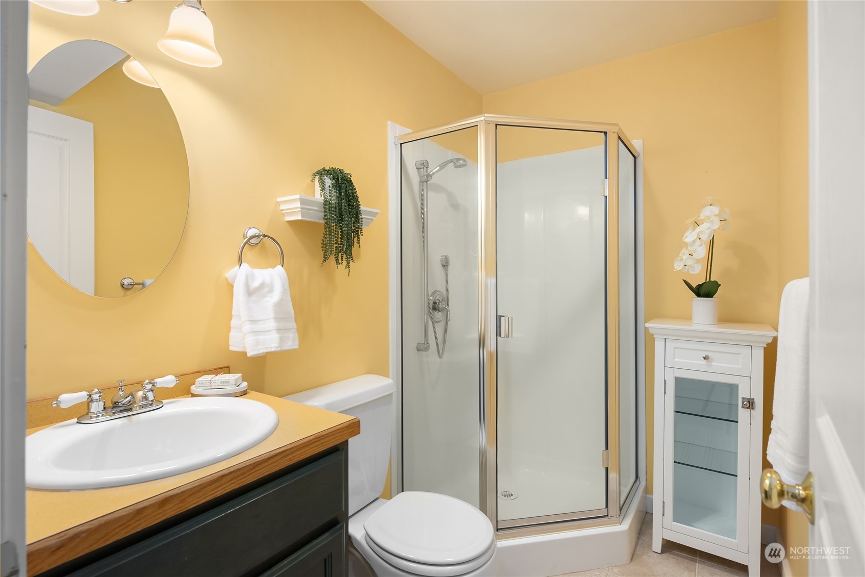 8251 Northeast Beck Road Bainbridge Island, WA 98110 - Photo 33 of 40 a bathroom with a sink toilet and shower