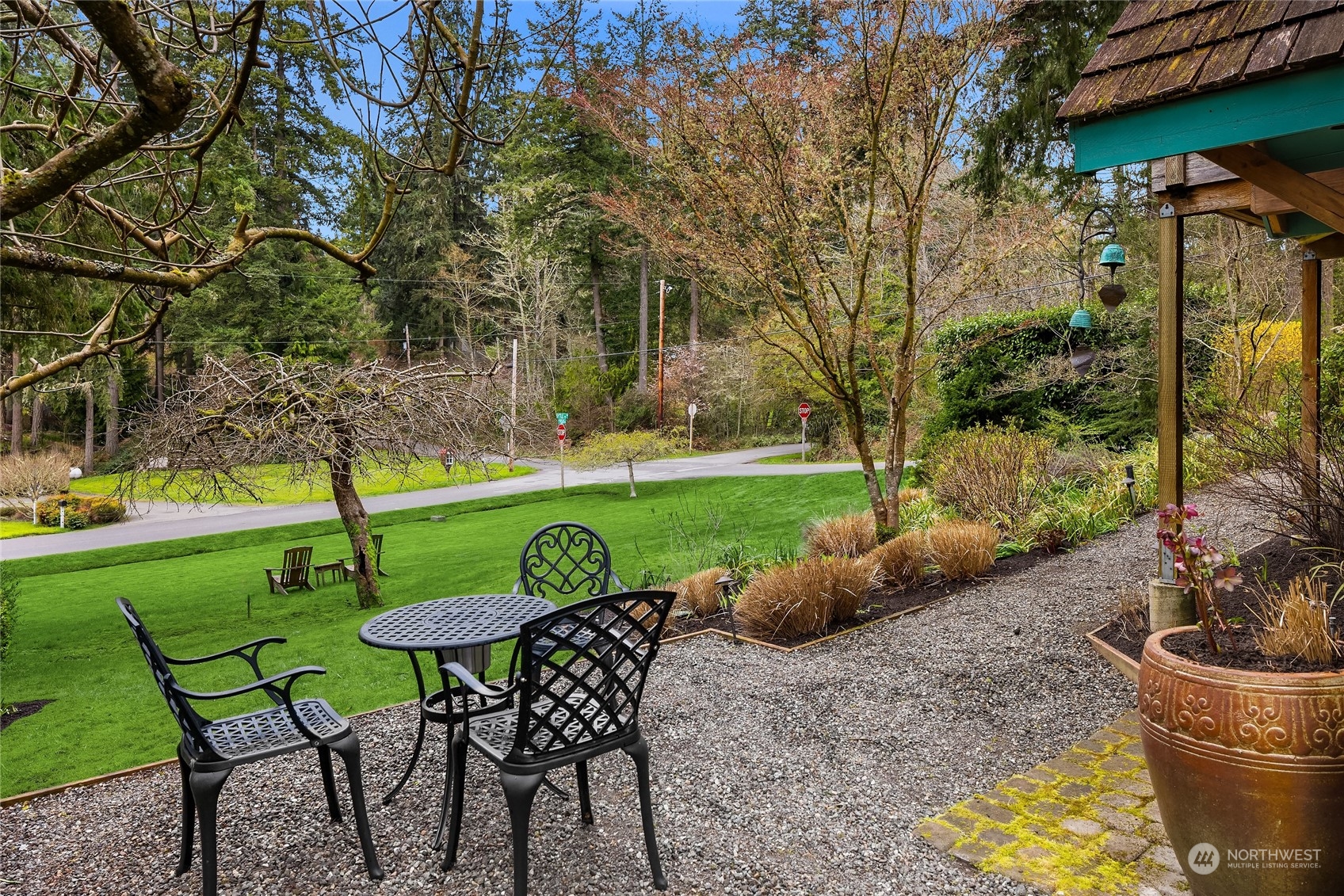8251 Northeast Beck Road Bainbridge Island, WA 98110 - Photo 36 of 40 a view of a table and chairs in backyard