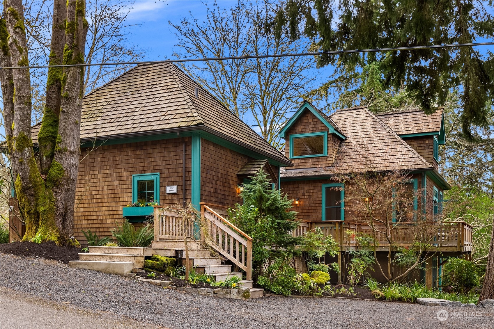 8251 Northeast Beck Road Bainbridge Island, WA 98110 - Photo 4 of 40 a front view of a house with garden