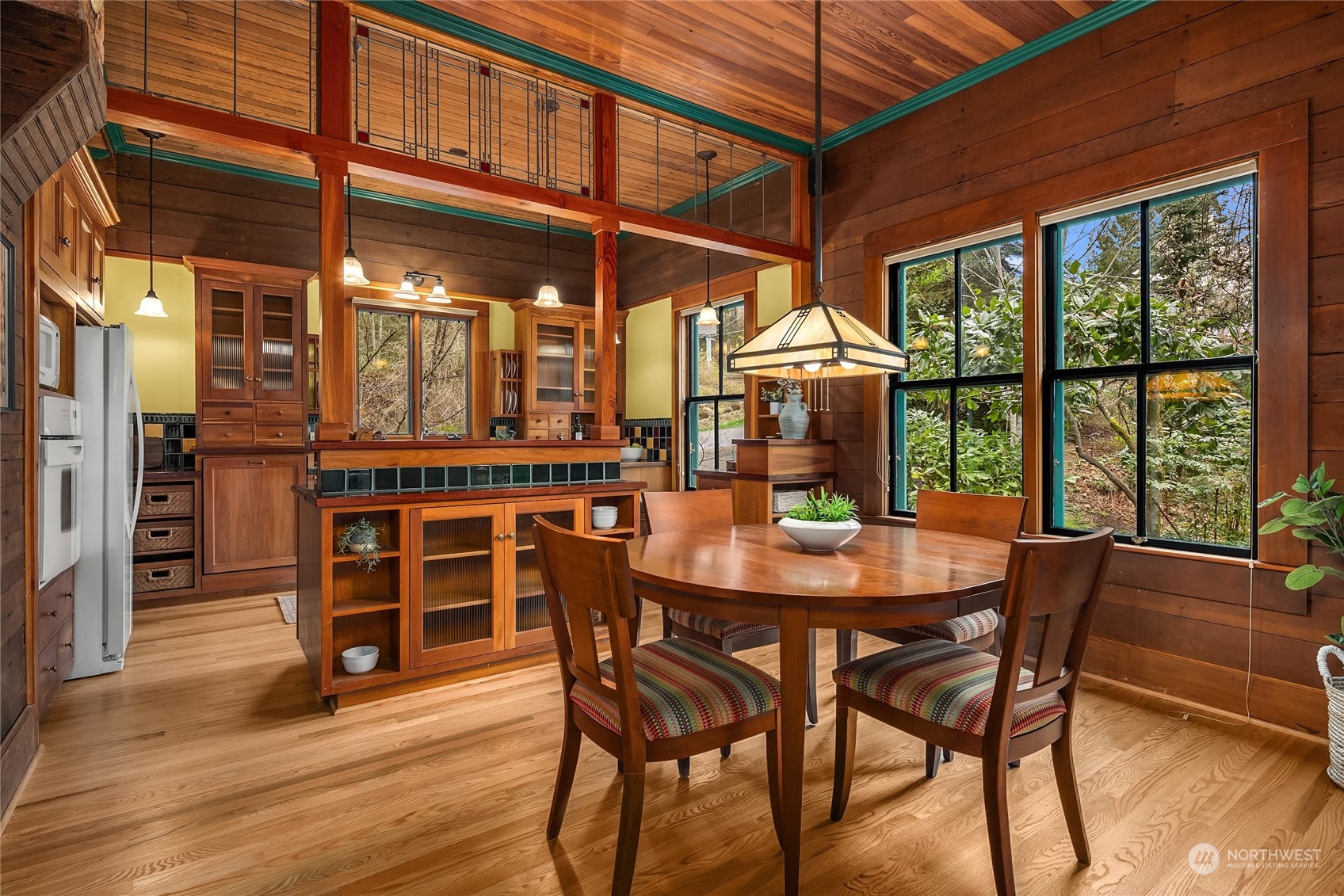 8251 Northeast Beck Road Bainbridge Island, WA 98110 - Photo 7 of 40 a dining room with furniture window and wooden floor