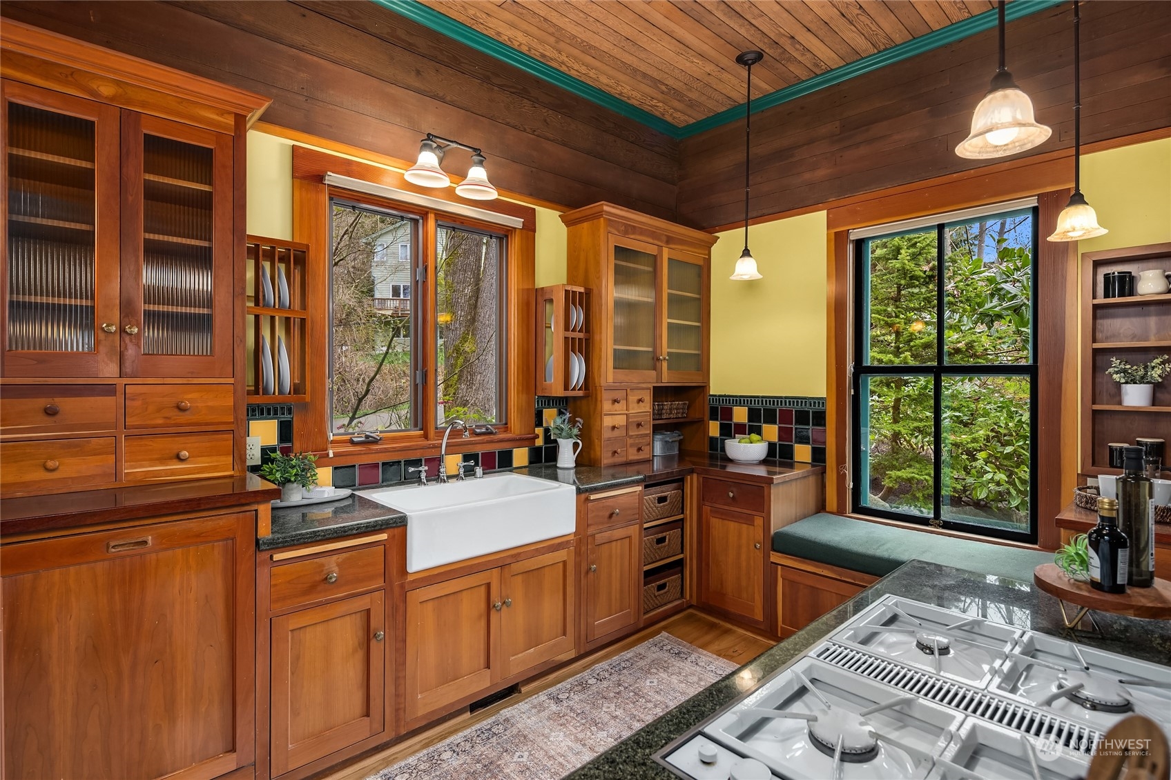 8251 Northeast Beck Road Bainbridge Island, WA 98110 - Photo 9 of 40 a kitchen that has a lot of cabinets in it