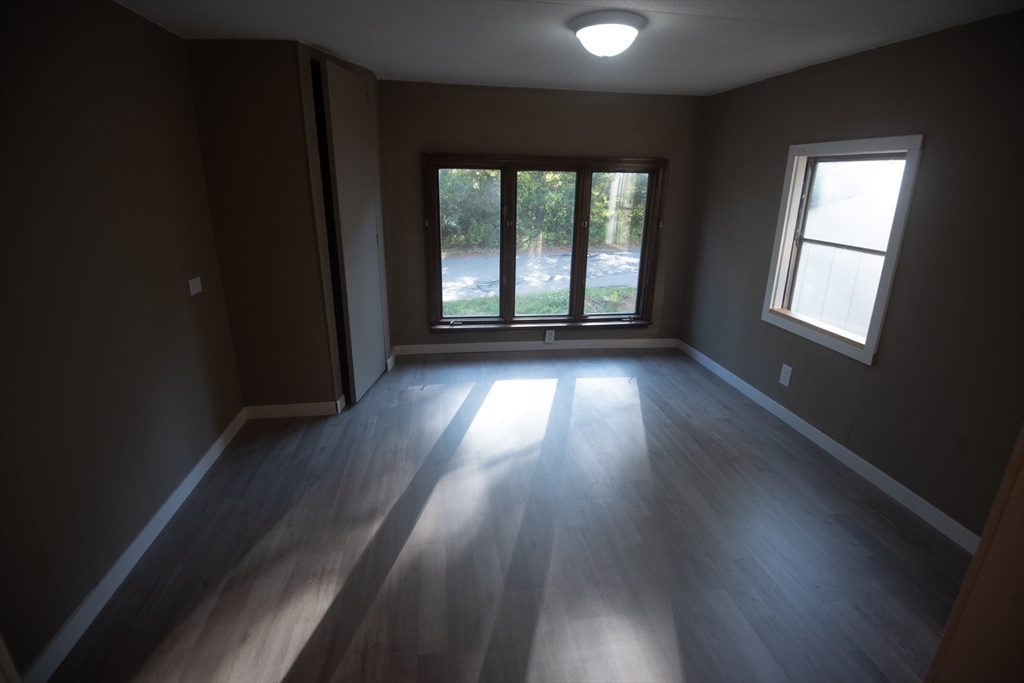 20 Dana Road Barre, MA 01005 - Photo 22 of 38 an empty room with wooden floor and windows
