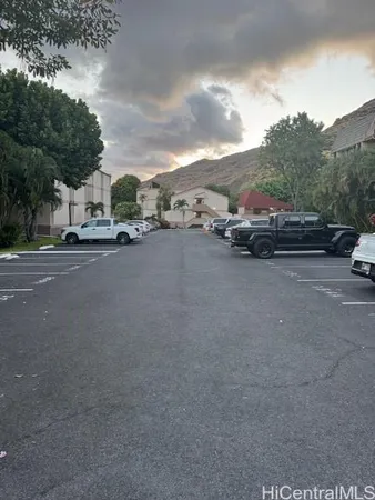 a view of street with parked cars