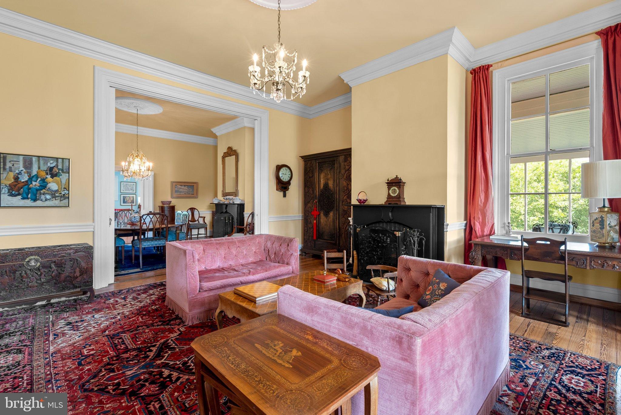 15701 Dr Bowen Road Aquasco, MD 20608 - Photo 13 of 89 a living room with fireplace furniture and a chandelier