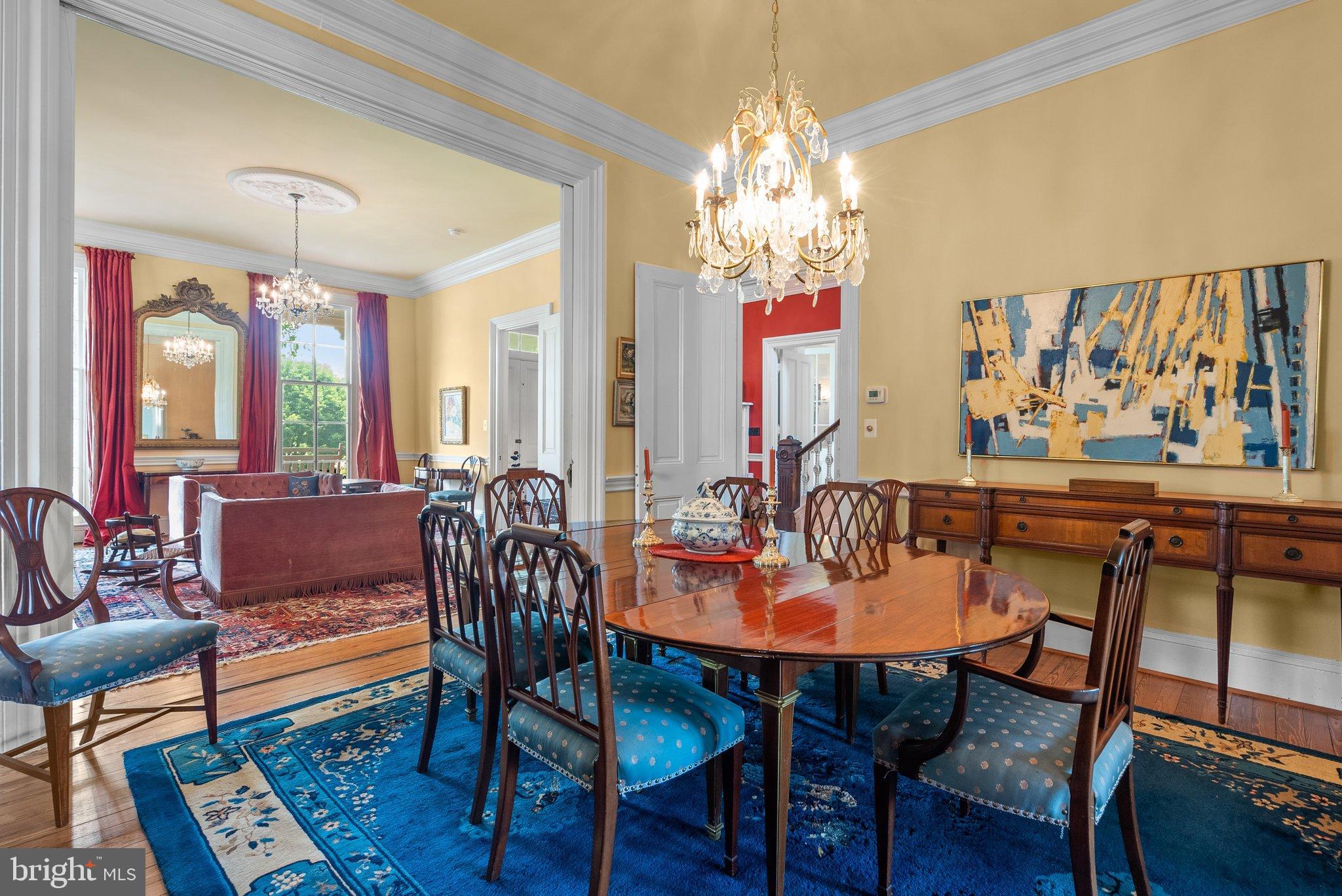 15701 Dr Bowen Road Aquasco, MD 20608 - Photo 14 of 89 a view of a dining room with furniture a chandelier and wooden floor