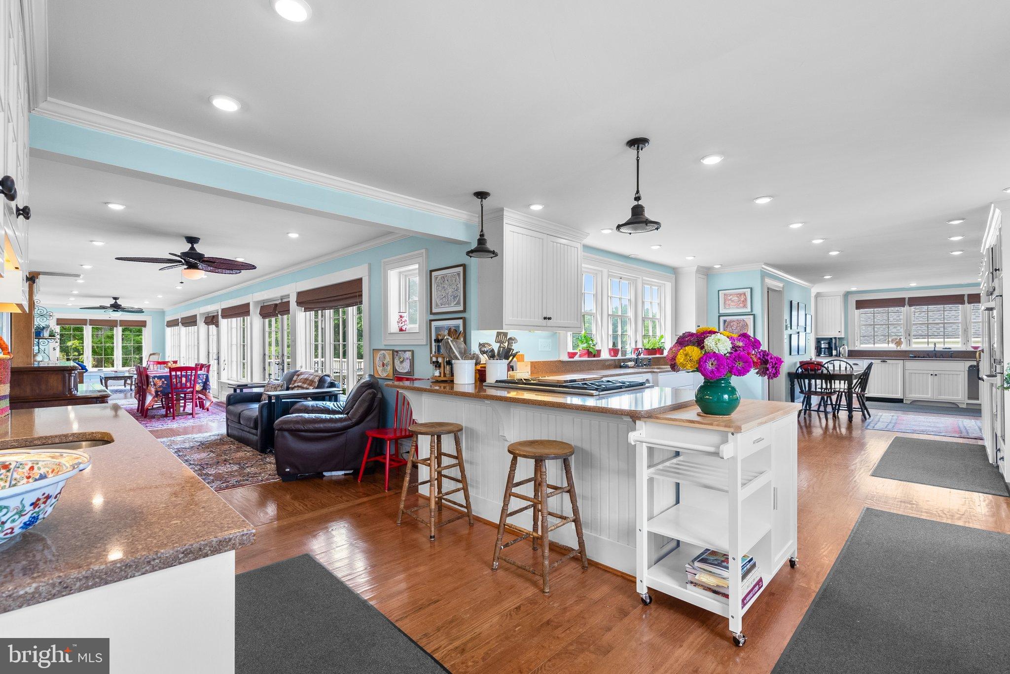15701 Dr Bowen Road Aquasco, MD 20608 - Photo 16 of 89 a living room with kitchen island furniture and a chandelier
