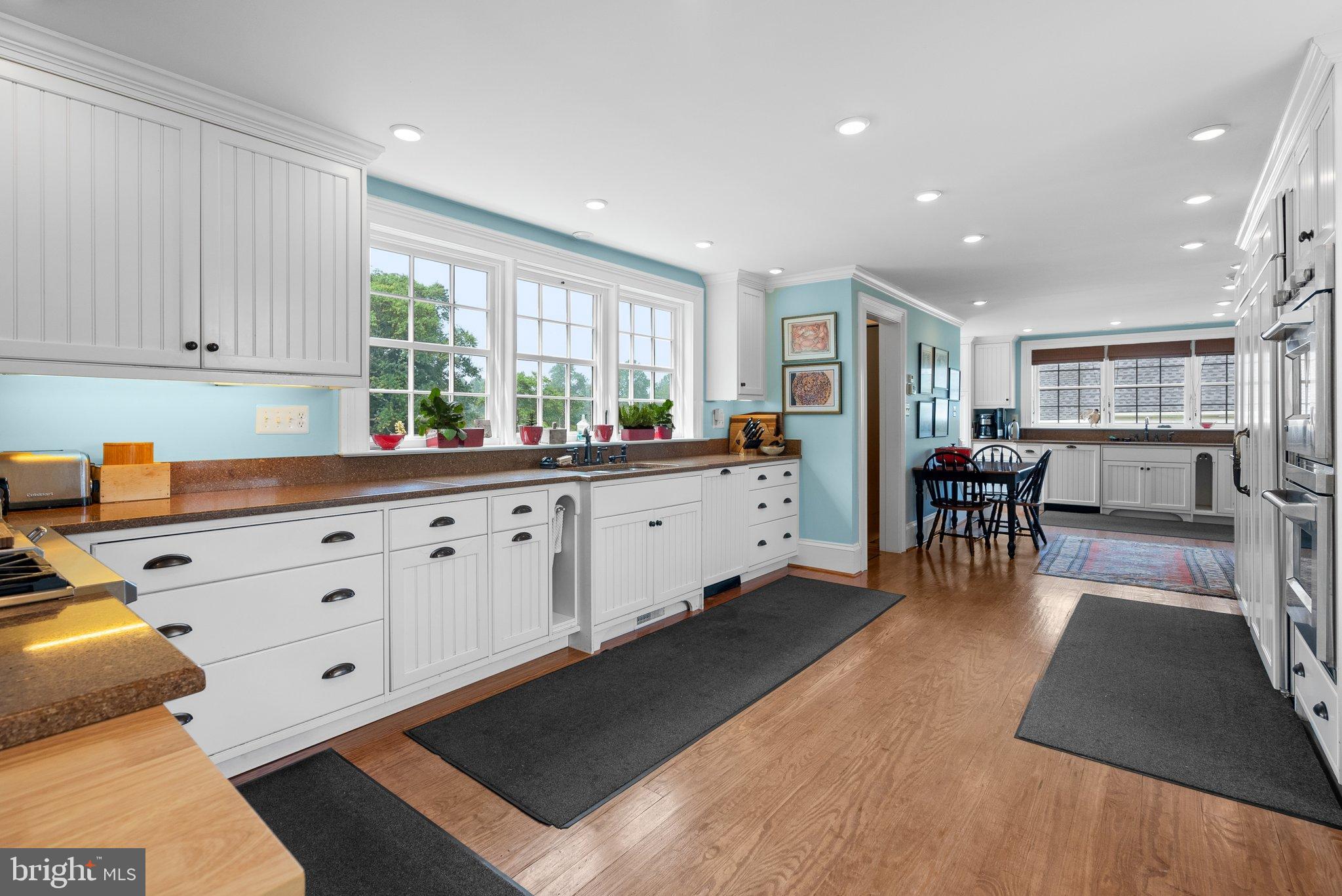 15701 Dr Bowen Road Aquasco, MD 20608 - Photo 17 of 89 a kitchen with stainless steel appliances sink cabinets and window