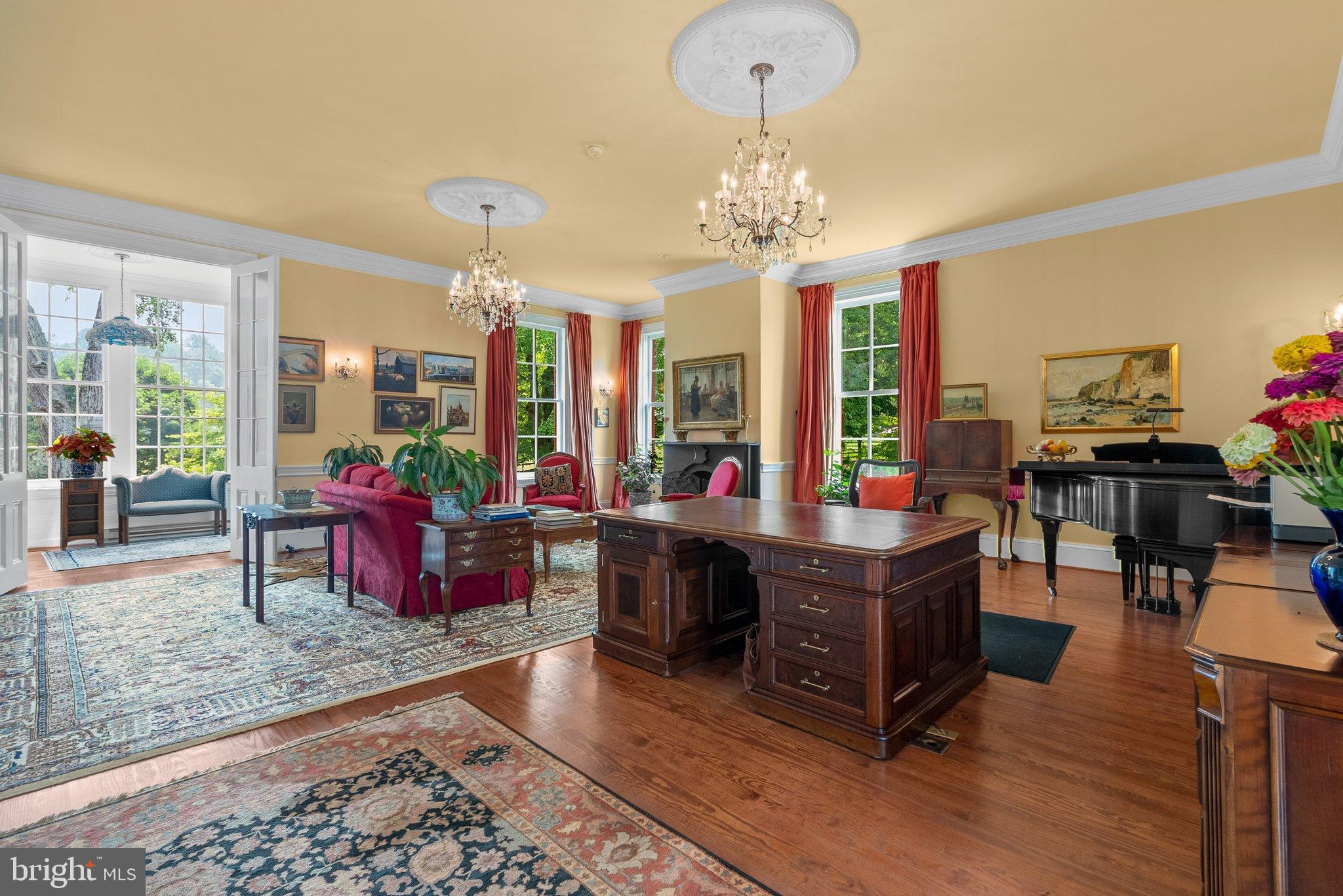 15701 Dr Bowen Road Aquasco, MD 20608 - Photo 24 of 89 a view of a dining room with furniture a chandelier and wooden floor