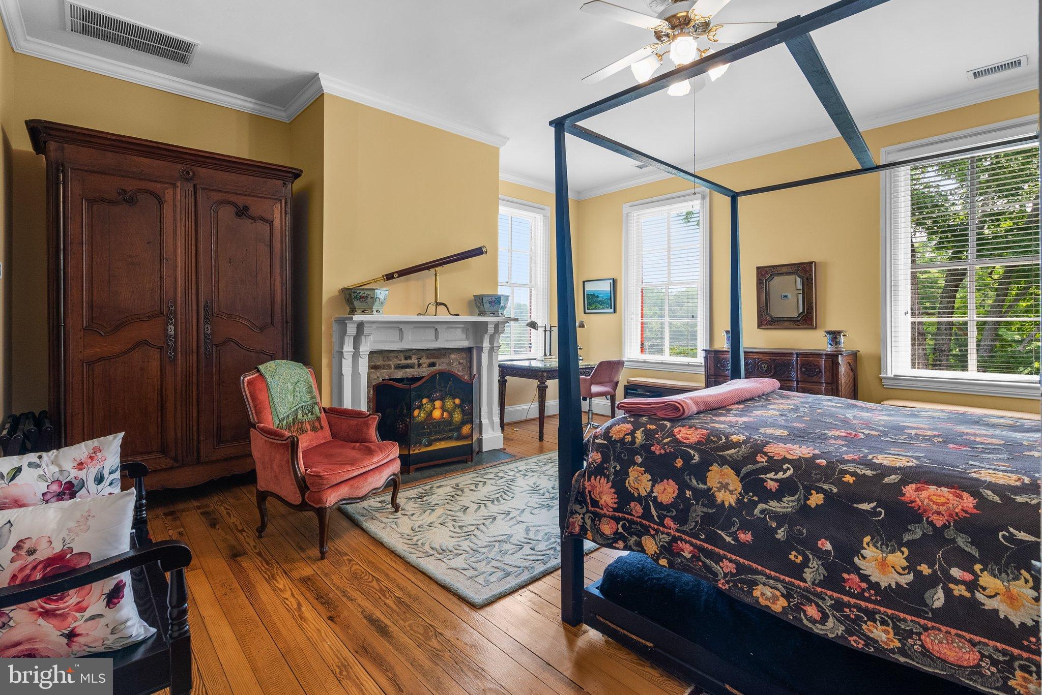 15701 Dr Bowen Road Aquasco, MD 20608 - Photo 28 of 89 a bedroom with a bed a table and chair