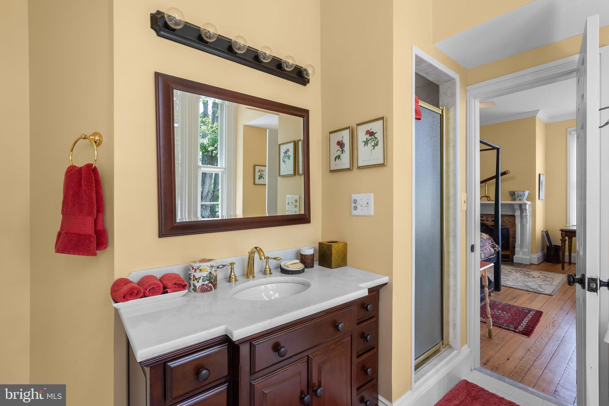 15701 Dr Bowen Road Aquasco, MD 20608 - Photo 30 of 89 a bathroom with a granite countertop sink and a mirror