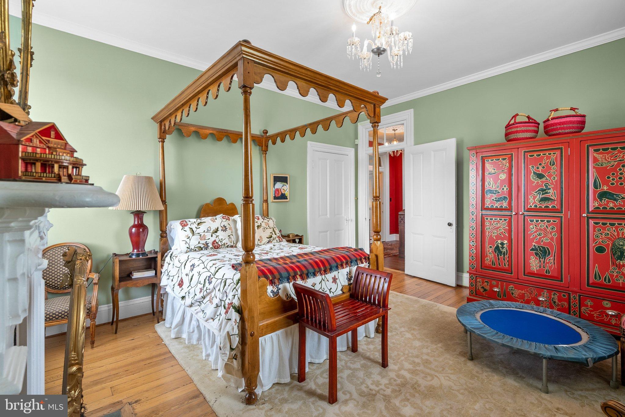 15701 Dr Bowen Road Aquasco, MD 20608 - Photo 39 of 89 a bedroom with furniture and a chandelier