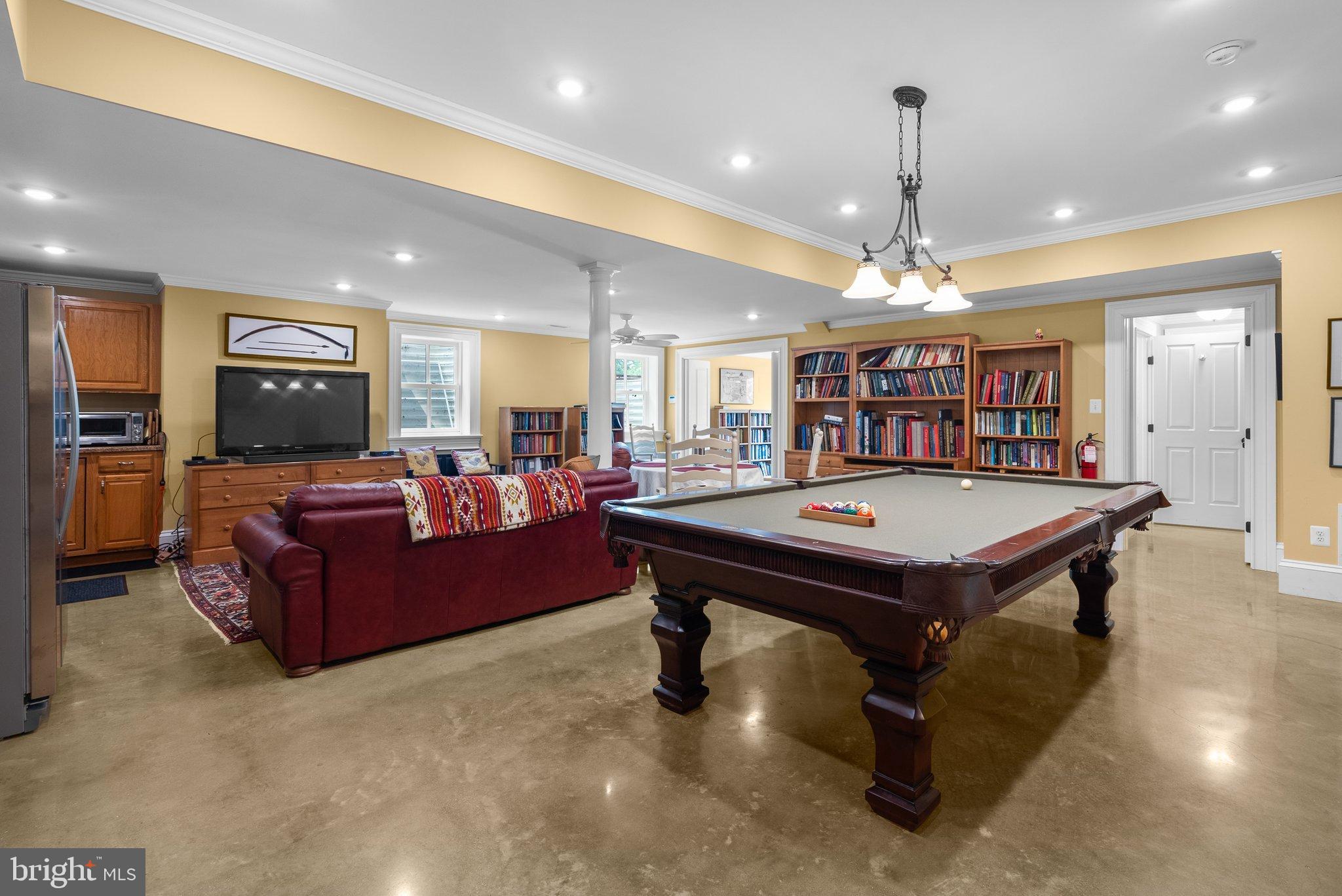 15701 Dr Bowen Road Aquasco, MD 20608 - Photo 48 of 89 a living room with furniture a table and kitchen view