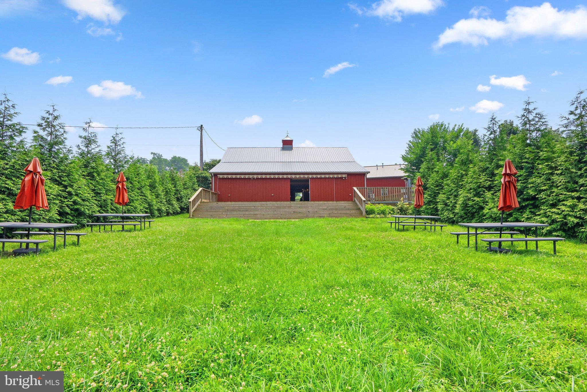 15701 Dr Bowen Road Aquasco, MD 20608 - Photo 6 of 89 a front view of a house with a yard table and chairs