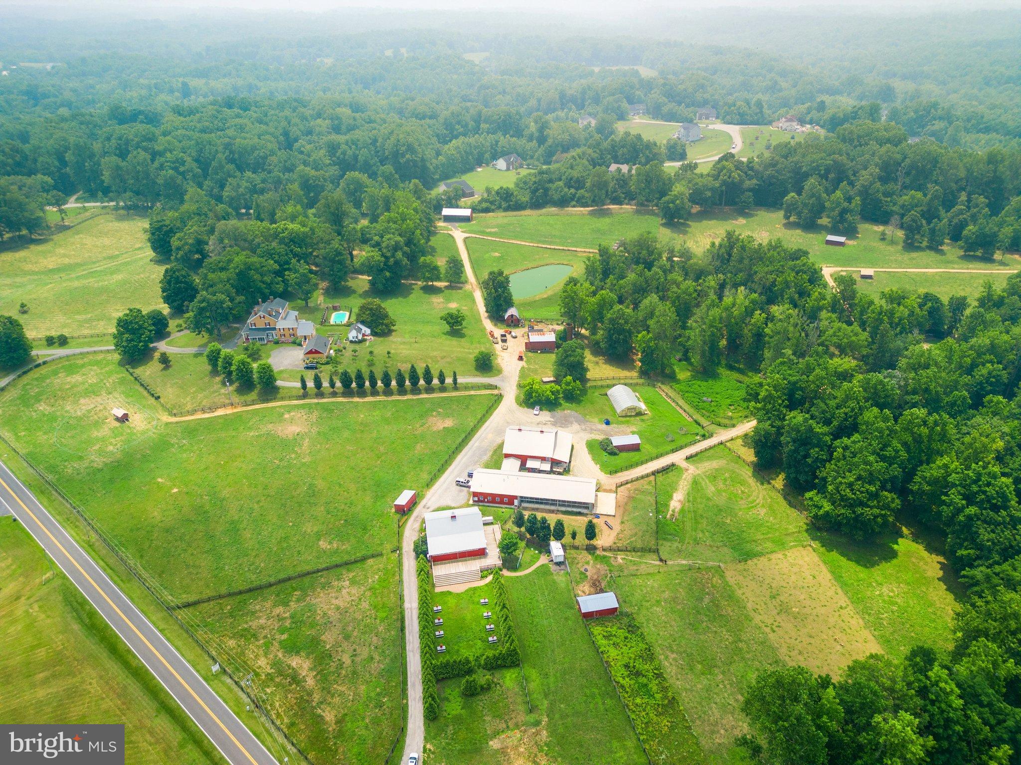 15701 Dr Bowen Road Aquasco, MD 20608 - Photo 81 of 89 an aerial view of residential houses with outdoor space and trees