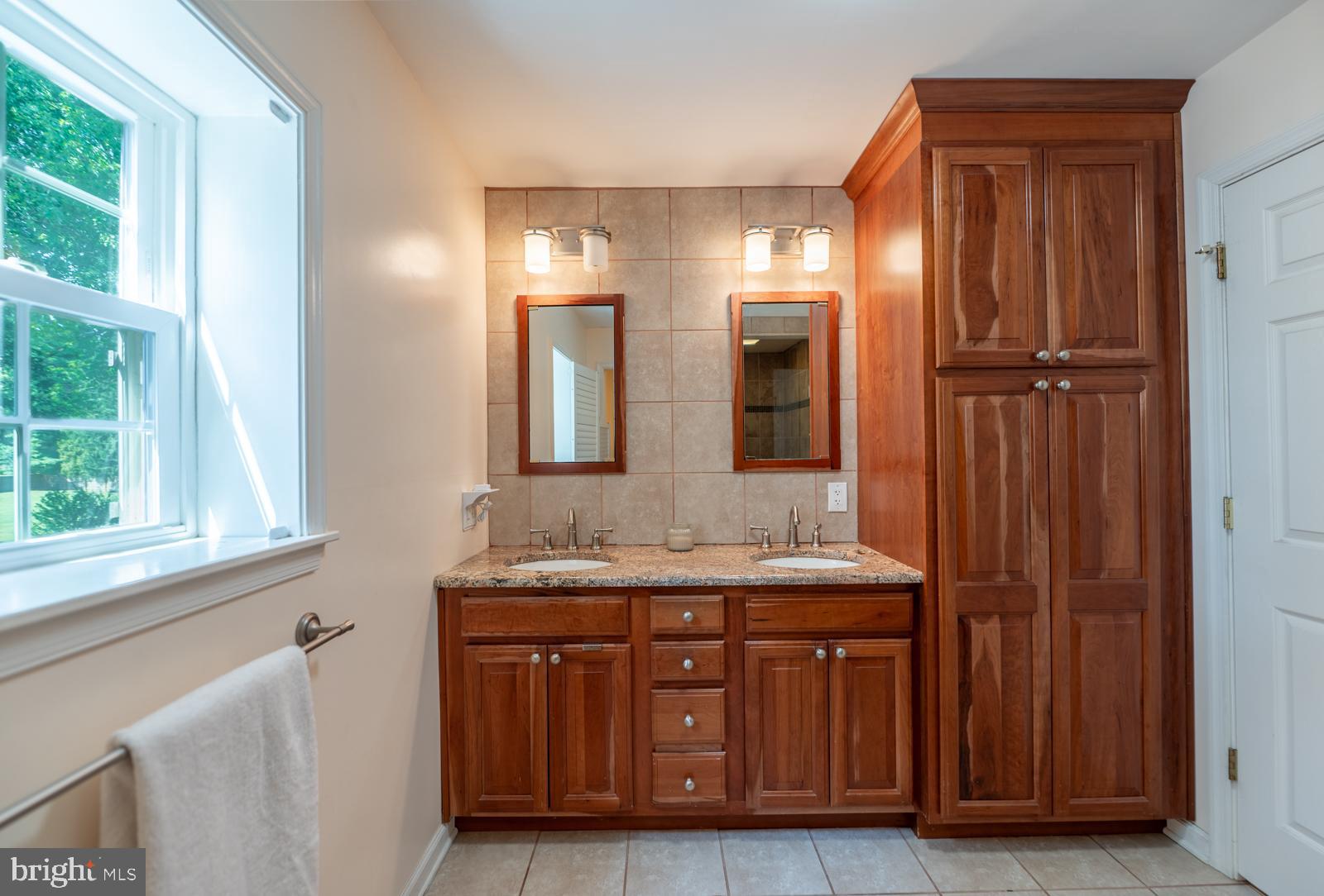 22 Salisbury Lane Malvern, PA 19355 - Photo 22 of 57 a bathroom with a granite countertop sink and a mirror